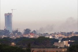 Smoke billows on November 25, 2014 from the Mitiga airport in an eastern suburb of the Libyan capital Tripoli held by anti-government militias, after an airstrike by forces loyal to Libya's internationally recognised government
