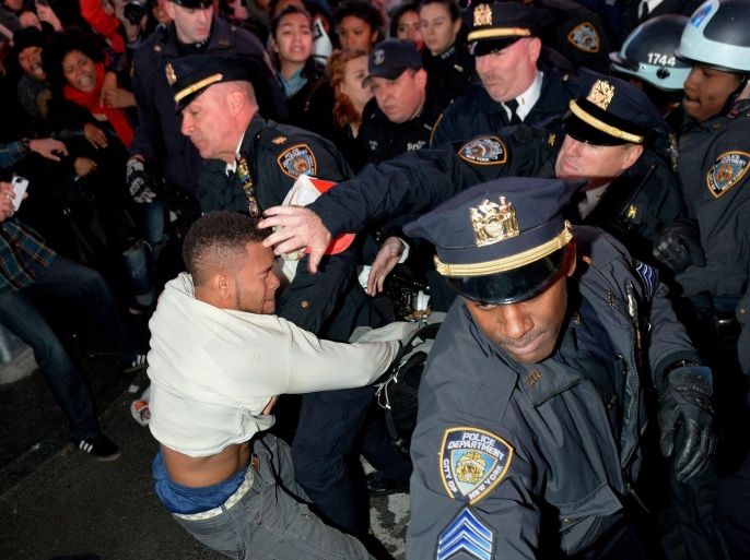 Police and protester clash at Times Square during a protest against the St. Louis County grand jury decision not to bring criminal charges against Darren Wilson, the white police officer who fatally shot Michael Brown, in New York, New York, USA, 25 November 2014. The grand jury has decided there was 'no probable cause' to indict Darren Wilson, the white police officer who killed unarmed African-American teenager Michael Brown in an August shooting in Ferguson, Missouri, St Louis County prosecutor Robert McCulloch said.