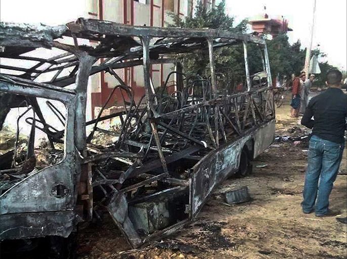 BEHEIRA, EGYPT - NOVEMBER 5: The view of burned bus after it collided with a tank truck loaded with gasoline in Beheira, Egypt, on November 5, 2014. At least 16 schoolchildren were killed and others injured when their bus collided with a tank truck loaded with gasoline in the northern province of Beheira, a health official said.