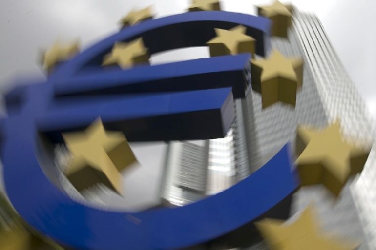 A euro logo sculpture stands in front the headquarters of the European Central Bank (ECB) in Frankfurt October 26, 2014. Twenty five euro zone banks failed a landmark health check of their ability to withstand another economic crisis with a capital shortfall of 25 billion euros at the end of last year, the ECB said on Sunday. REUTERS/Ralph Orlowski (GERMANY - Tags: BUSINESS)
