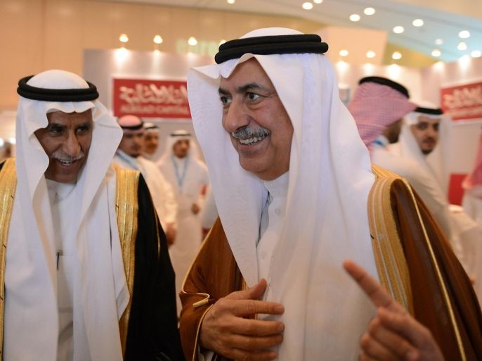Saudi Minister of Finance Ibrahim bin Abdul Aziz al-Assaf (R) arrives to attend the Euromoney conference, on May 6, 2014 in Riyadh. The two-day conference focuses on Saudi Arabia's economy and financial system. AFP PHOTO/FAYEZ NURELDINE