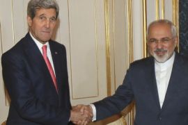 U.S. Secretary of State John Kerry (L) and Iranian Foreign Minister Javad Zarif (R) shake hands before a meeting in Vienna November 23, 2014. Iran, the United States and other world powers are all but certain to miss Monday's deadline for negotiations to resolve a 12-year stand-off over Tehran's atomic ambitions, forcing them to seek an extension, sources say. The talks in Vienna could lead to a transformation of the Middle East, open the door to ending economic sanctions on Iran and start to bring a nation of 76 million people in from the cold after decades of hostility with the West. REUTERS/Ronald Zak/Pool (AUSTRIA - Tags: POLITICS ENERGY)