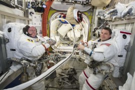 NASA astronauts Reid Wiseman (R) and Barry Wilmore work inside the International Space Station on October 1, 2014. The two spacewalking NASA astronauts hustled and muscled through an electrical repair job outside the International Space Station on October 15, 2014 completing their task with two minutes to spare. Picture taken on October 1, 2014. REUTERS/NASA/Handout (OUTER SPACE - Tags: SCIENCE TECHNOLOGY) FOR EDITORIAL USE ONLY. NOT FOR SALE FOR MARKETING OR ADVERTISING CAMPAIGNS. THIS IMAGE HAS BEEN SUPPLIED BY A THIRD PARTY. IT IS DISTRIBUTED, EXACTLY AS RECEIVED BY REUTERS, AS A SERVICE TO CLIENTS