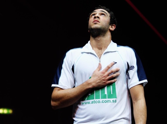 LONDON, ENGLAND - JANUARY 13: Ramy Ashour of Egypt celebrates winning his match during the match between Ramy Ashour of Egypt and Alister Walker of England during day three of the ATCO PSA World Series Squash Finals at Queens Club on January 13, 2011 in London, England.