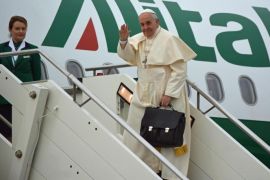 Pope Francis (R) waves before his departure for Ankara, at the Leonardo Da Vinci's airport in Fiumicino (Rome), Italy, 28 November 2014. Pope Francis set off on a three-day trip to Turkey during which he is expected to focus on Catholic-Orthodox reconciliation, as well as reaching out to Muslims and condemning the persecution of Christians in the Middle East.