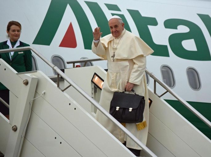 Pope Francis (R) waves before his departure for Ankara, at the Leonardo Da Vinci's airport in Fiumicino (Rome), Italy, 28 November 2014. Pope Francis set off on a three-day trip to Turkey during which he is expected to focus on Catholic-Orthodox reconciliation, as well as reaching out to Muslims and condemning the persecution of Christians in the Middle East.
