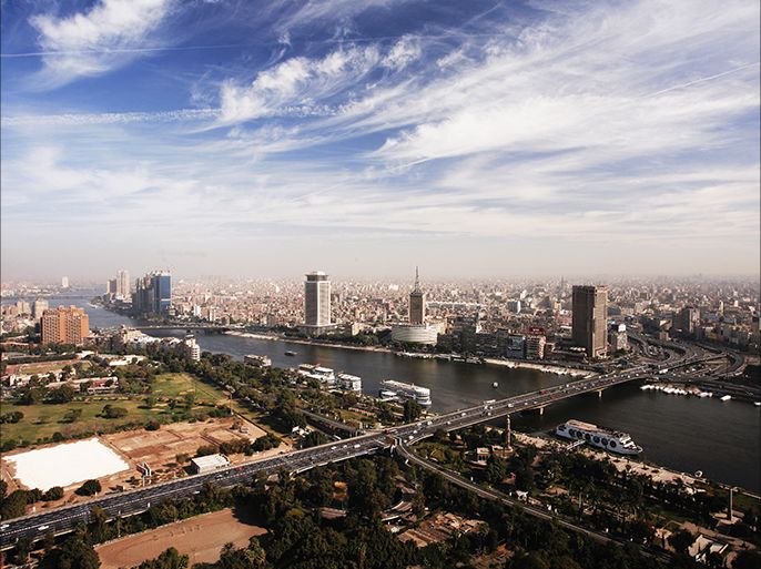 epa04480502 A general view of the 6 October Bridge traversing River Nile from Gezira Island (foreground) to Cairo City Center (background), Cairo, Egypt, 07 November 2014. The buildings are: the Ministry of Foreign Affairs (C-L), the Maspero Television building housing the Egyptian Radio and TV Union (C) and the Ramses Hilton Hotel (C-R). EPA/BEN WENZ