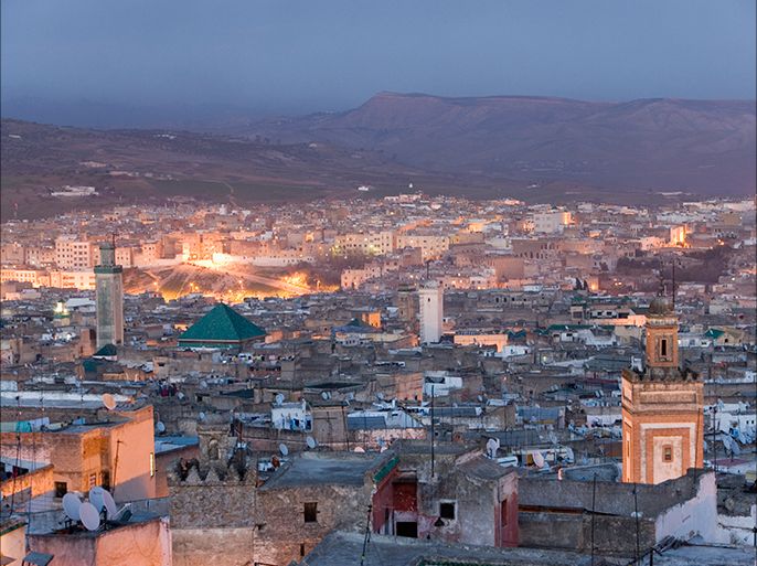 Morrocco, Fez, Medina, cityscape illuminated at dusk, elevated viege