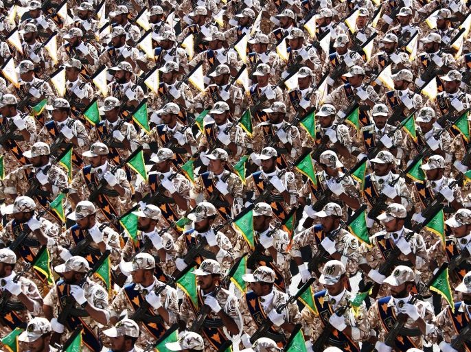 Iranian Revolutionary Guards troops march during the annual military parade marking the anniversary of Iran's war with Iraq (1980-88) in Tehran, on September 22, 2014. Iran is a cornerstone of stability in the Middle East in the face of the 'terrorists' rocking the region, President Hassan Rouhani said before leaving for the United Nations. AFP PHOTO/ BEHROUZ MEHRI
