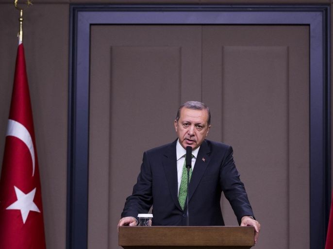 ANKARA, TURKEY - NOVEMBER 19: Turkish President Recep Tayyip Erdogan holds a press conference at the Esenboga Airport ahead of his official visit to Algeria, on November 19, 2014, in Ankara, Turkey.
