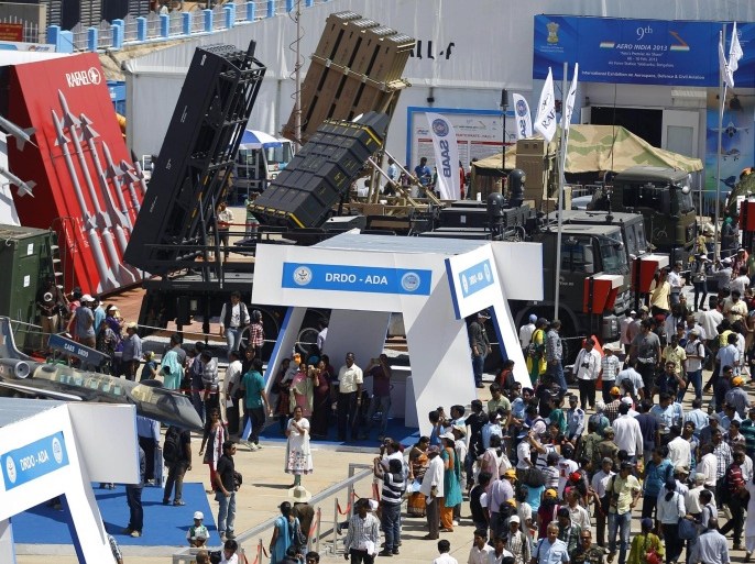 Visitors walk past a display of missiles and other combat equipment by Israel's Rafael Advanced Defense Systems Ltd. on the last day of the Aero India 2013 at Yelahanka air base in Bangalore, India, Sunday, Feb. 10, 2013. More than 600 aviation companies along with delegations from 78 countries took part in the five-day event.