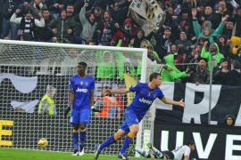 Juventus' Stephan Lichtsteiner (R) jubilates after scoring a goal during the Italian Serie A soccer match between Juventus FC and Parma FC at Juventus Stadium in Turin, Italy, 09 November 2014.