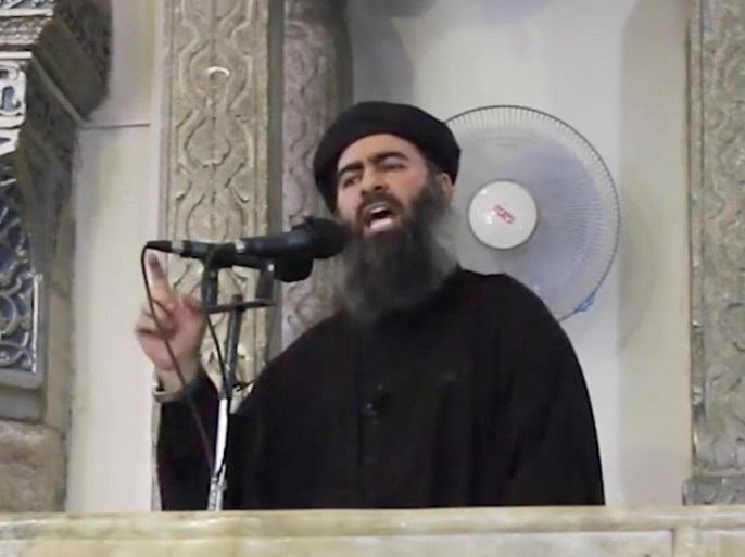 FILE - This Saturday, July 5, 2014 file image made from video posted on a militant website, which has been authenticated based on its contents and other AP reporting, purports to show the leader of the Islamic State group, Abu Bakr al-Baghdadi, delivering a sermon at a mosque in Iraq. The Islamic State group will likely take center stage when more than 140 heads of state of government convene for the U.N. General Assembly the week of Sept. 22. (AP Photo/File)