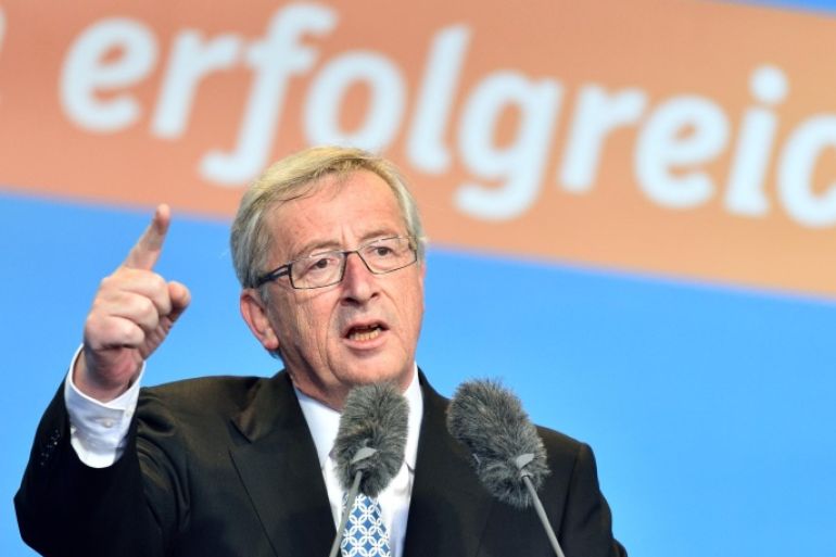 The Christian Democratic frontrunner Jean-Claude Junker speaks during an election campaign event for the European election on 25 May 2014 in Worms, Germany, 24 May 2014. Letters in background read "successful". (AP Photo/dpa,Uwe Anspach)
