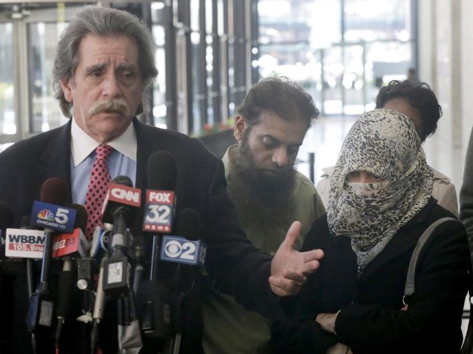 Attorney Thomas Dirkin, left, talks to reporters as Shafi and Zarine Khan, parents of Mohammed Hamzah Khan, stand nearby, after a federal magistrate judge put off ruling on whether the 19-year-old Khan, accused of trying to join Islamic State militants in Syria, should stay behind bars pending trial Thursday, Oct. 9, 2014, in Chicago. Khan's detention hearing on Thursday followed his arrest last week at O'Hare International Airport as he attempted to board a plane to Turkey. (AP Photo/Charles Rex Arbogast)