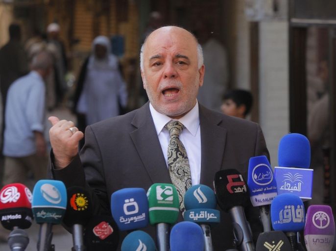 Iraqi Prime Minister Haider al-Abadi speaks to reporters after a meeting with the top Shiite cleric, Grand Ayatollah Ali al-Sistani, in the Shiite holy city of Najaf, south of Baghdad, October 20, 2014. REUTERS/Alaa Al-Marjani (IRAQ - Tags: RELIGION POLITICS)