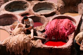 A Moroccan man works at an old colour factory for leather in Fes, Morocco, 26 April 2008. Morocco is famous for producing high quality soft leather as the tanning and dyeing works have been in use for centuries. Fes is one of the oldest and largest medieval cities in the world, a city that has remained almost unchanged through the modern ages. EPA