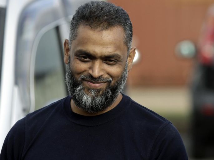 British Moazzam Begg leaves Belmarsh Prison in south London, after his release, Wednesday, Oct. 1, 2014. British prosecutors dropped terrorism charges Wednesday against the former Guantanamo Bay detainee who is a high-profile advocate for the rights of terror suspects. Begg, who has been in prison for seven months awaiting trial, had been due to stand trial next week on seven counts relating to the war in Syria. But in a last-minute reversal, prosecutors acknowledged that new evidence had emerged that undermined the case. (AP Photo/Lefteris Pitarakis)