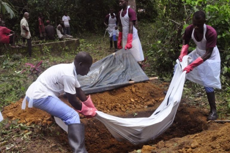Ebola health care workers bury the body of a person suspected of dying from the Ebola, on the outskirts of Monrovia, Liberia, Saturday, Nov. 8, 2014. Dr. Robert Fuller didn't hesitate to go to Indonesia to treat survivors of the 2004 tsunami, to Haiti to help after the 2010 earthquake or to the Philippines after a devastating typhoon last year. But he's given up on going to West Africa to care for Ebola patients this winter. (AP Photo/ Abbas Dulleh)
