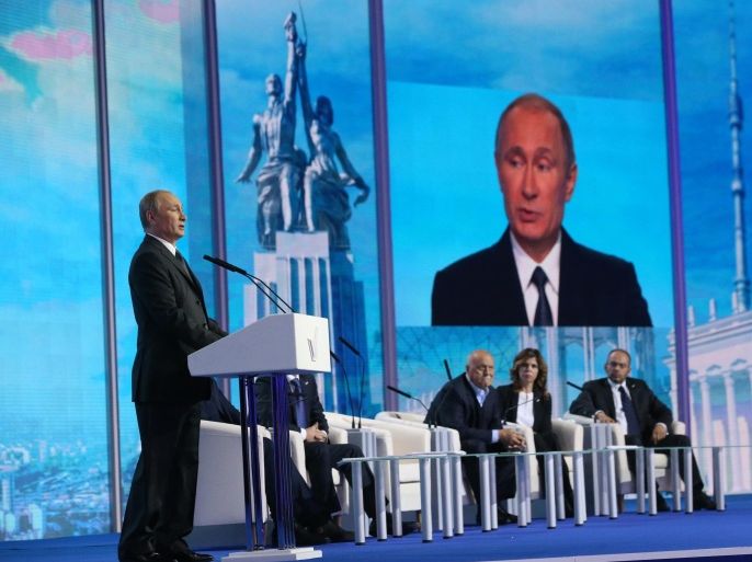 MOSCOW, RUSSIA - NOVEMBER 18: Russian President Vladimir Putin speaks during a meeting of the United People's Front Forum on November 18, 2014 in Moscow, Russia. Putin attended the meeting of his supporters, gathered in Moscow.