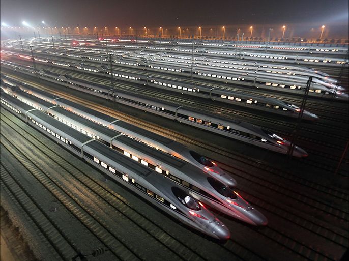 epa04392356 (FILE) A file photo dated 25 December 2012 showing a general view shows CRH380 (China Railway High-speed) trains at a high-speed train maintenance base in Wuhan city, central China's Hubei province. China will speed up the construction of its high-speed railway network, already the world's largest, official media reported 09 September 2014. The state railway company said it had increased investment in the first eight months of the year by 20 per cent, the Xinhua news agency reported. China will spend 800 billion yuan (130 billion dollars) on expanding its rail network this year. There are currently more than 10,000 kilometres of high-speed rail lines in China. EPA/STRINGER