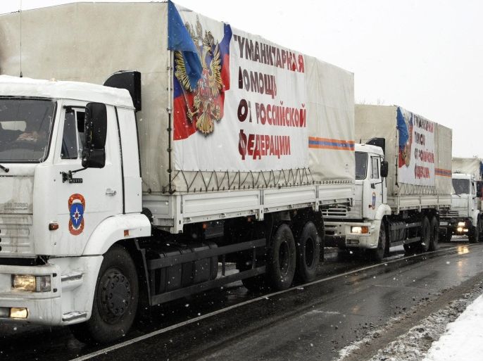 Trucks of a Russian aid convoy carrying banners reading 'Humanitarian help from Russian Federation' wait to be unloaded in Donetsk, Ukraine, 30 November 2014. More than one hundred trucks said to be transporting humanitarian aid crossed into self-proclaimed Donetsk and Luhansk People's Republics (DNR and LNR) in the eastern Ukraine from Russian territory. An official for the Russian Ministry of Emergency Situations said the trucks carried construction materials, food and other essentials and crossed into Ukraine via Donetsk, Russia with customs clearance. Ukrainian officials renewed their accusations towards Russia saying they were supporting separatist rebels with arms and ammunition.