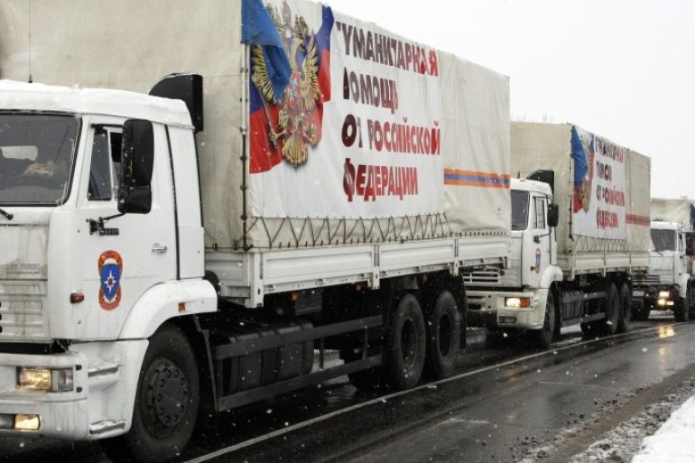 Trucks of a Russian aid convoy carrying banners reading 'Humanitarian help from Russian Federation' wait to be unloaded in Donetsk, Ukraine, 30 November 2014. More than one hundred trucks said to be transporting humanitarian aid crossed into self-proclaimed Donetsk and Luhansk People's Republics (DNR and LNR) in the eastern Ukraine from Russian territory. An official for the Russian Ministry of Emergency Situations said the trucks carried construction materials, food and other essentials and crossed into Ukraine via Donetsk, Russia with customs clearance. Ukrainian officials renewed their accusations towards Russia saying they were supporting separatist rebels with arms and ammunition.
