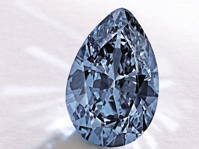 In this image provided by Sotheby’s shows a Fancy Vivid Blue pear-shaped diamond from the estate of Rachel "Bunny" Mellon which sold Thursday Nov. 20, 2014 for $32.6 million. It's an auction record for any blue diamond. It was sold to an anonymous Hong Kong collector. (AP Photo/Sotheby)