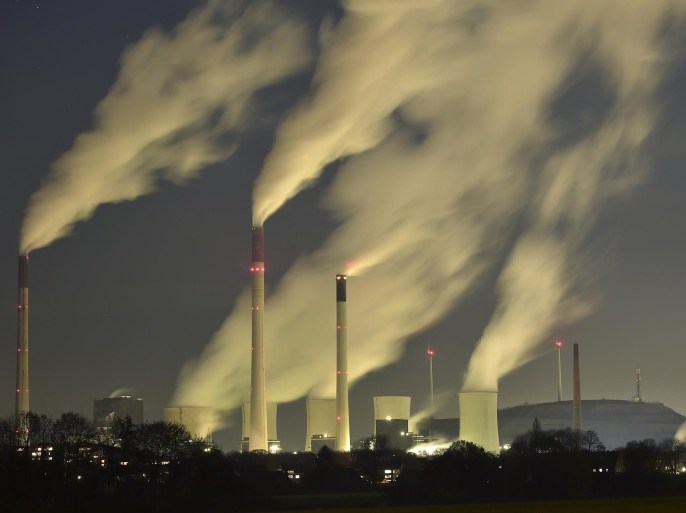 Smoke streams from the chimneys of the E.ON coal-fired power station in Gelsenkirchen, Germany, Monday night, Nov. 24, 2014, and with a capacity of around 2300 MW of power it is one of the most powerful coal-fired power stations in Europe. Coal power plants are under pressure due to the German targets for reducing carbon-dioxide emissions. (AP Photo/Martin Meissner)