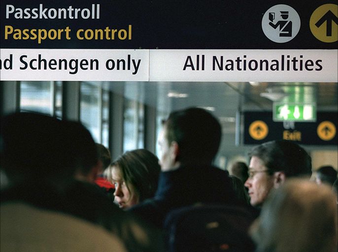 STO02 - 20010325 - STOCKHOLM, SWEDEN : Angry travellers queue for passport control at Stockholm airport Arlanda as Sweden and the four other Nordic countries, Norway, Denmark, Finland and Iceland, joined the Schengen Treaty Sunday 25 March 2001. The first day of visa-free travel was marked by crashing passport computers, queuing passengers and frustrated flight crews as the Schengen information system computers went offline and customs had to revert to manually checking all passports. EPA