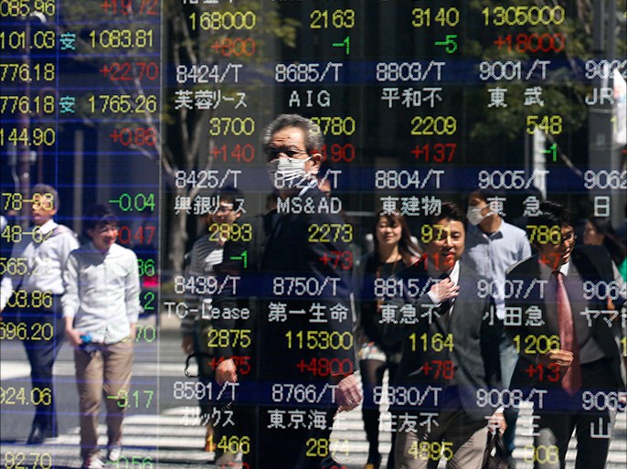 epa03653608 Pedestrians are watching Tokyo stock indexes on a public display board in Tokyo, Japan, 08 April 2013. Japanese stocks soared 08 April on a weaker Yen and a report that the Bank of Japan would start to buy government bonds this week. The benchmark Nikkei 225 Stock Average gained 358.95 points, or 2.8 per cent, to end at 13,192.59 while the broader-based Topix index was up 35.5 points, or 3.33 per cent, at 1,101.74. The central bank was expected to buy government bonds worth 1.2 trillion yen (12.2 billion US dollars) this week, the Nikkei business daily reported Sunday without citing any sources.