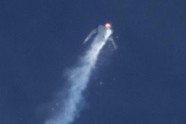 The Virgin Galactic SpaceShipTwo rocket explodes in mid-air during a test flight above the Mojave Desert in California October 31, 2014. The passenger spaceship being developed by Richard Branson's Virgin Galactic company crashed during a test flight on Friday near the Mojave Air and Space Port in California, killing one pilot and seriously injuring the other, officials said. REUTERS/Kenneth Brown (UNITED STATES - Tags: SCIENCE TECHNOLOGY DISASTER TRANSPORT)