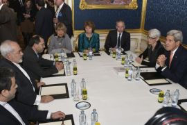 Iranian Foreign Minister Javad Zarif (2-L), the European Union's negotiator Catherine Ashton (C) and US Secretary of State John Kerry (R) sit at a conference table prior to their talks between the E3+3 (France, Germany, UK, China, Russia, US) and Iran in Vienna, Austria, 21 November 2014. Others are not identified. High-level negotiators are working on a deal that would cut back Tehran's civilian nuclear programme and reduce the risk that it could be used for making nuclear weapons. Kerry on 20 November had warned that the six powers negotiating the nuclear deal with Iran would not be rushed into closing an agreement that does not meet their standards.