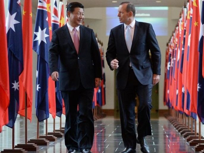 Chinese President Xi Jinping (L) and Australian Prime Minister Tony Abbott walk together as they leave the House of Representatives at Parliament House in Canberra, Australia, 17 November 2014. Chinese President Xi Jinping, who attended the G20 leadership summit in Brisbane made an address to the Australian Parliament. The Chinese and the Australian governments have agreed on a Free Trade agreement, which will be signed on 17 November. EPA/LUKAS COCH AUSTRALIA AND NEW ZEALAND OUT