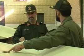 Islamic Revolutionary Guard Corps aerospace force commander Amir Ali Hajizadeh is briefed by a military officer (R) on what Iran says is a captured U.S. drone plane in an undisclosed location, in this still image taken from video footage broadcast by Iran's Al-Alam TV on February 6, 2013 and obtained by Reuters TV on February 7, 2013. Iran released what it said was the decoded footage taken by an unmanned U.S. RQ-170 reconnaissance drone plane that it captured more than a year ago, Iranian media reported. The grainy footage was broadcast on Iranian television late on Wednesday and showed images of what officials said were a U.S. base inside Afghanistan and several other aerial shots. Reuters was unable to confirm whether the footage was genuine but Iranian authorities have previously claimed to have decoded much of the data from the downed craft as well as valuable technology. REUTERS/Al-Alam TV via Reuters TV (IRAN - Tags: POLITICS MILITARY SCIENCE TECHNOLOGY) NO SALES. NO ARCHIVES. ATTENTION EDITORS - THIS PICTURE WAS PROVIDED BY A THIRD PARTY. REUTERS IS UNABLE TO INDEPENDENTLY VERIFY THE AUTHENTICITY, CONTENT, LOCATION OR DATE OF THIS IMAGE. FOR EDITORIAL USE ONLY. NOT FOR SALE FOR MARKETING OR ADVERTISING CAMPAIGNS. THIS PICTURE IS DISTRIBUTED EXACTLY AS RECEIVED BY REUTERS, AS A SERVICE TO CLIENTS. IRAN OUT. NO COMMERCIAL OR EDITORIAL SALES IN IRAN. NO ACCESS BBC PERSIAN TV / VOA PERSIAN NEWS NETWORK
