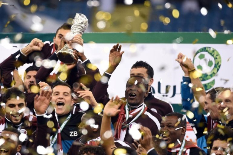 Qatar players celebrate with the Gulf cup trophy after defeating Saudi Arabia 2-1 in the final of the 22nd Gulf Cup football match at the King Fahad stadium in Riyadh, on November 26, 2014. AFP PHOTO/ FAYEZ NURELDINE