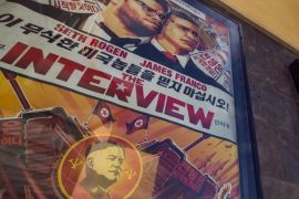 FILE - This Wed., Dec. 17, 2014 photo shows a movie poster for the movie "The Interview" on display outside the AMC Glendora 12 movie theater, in Glendora, Calif. In an unprecedented move, Sony Pictures broadly released "The Interview" to digital platforms Wednesday, Dec. 24, 2014, a reversal of its previous plan not to show the film after hackers released thousands of documents online and threatened violence at theaters showing the comedy that depicts the assassination of North Korean leader Kim Jong Un. (AP Photo/Damian Dovarganes, File)