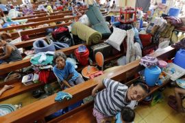 Filipino residents take shellter inside a church turned into a temporary evacuation center in Tacloban City, Leyte province, Philippines, 05 December 2014. Thousands of people were stranded in the Philippines after flights and sea travel were cancelled ahead of a powerful typhoons expected landfall. School classes were also suspended in central and eastern provinces being threatened by typhoon Hagupit, which gained strength as it moved closer to the Philippines. In Tacloban City, which was worst hit by Haiyan on November 8, 2013, thousands of residents have evacuated to schools, churches and public gyms away from the coast. The weather bureau said Hagupit was tracking almost the same path as super typhoon Haiyan, which left more than 7,300 people dead or missing last year.