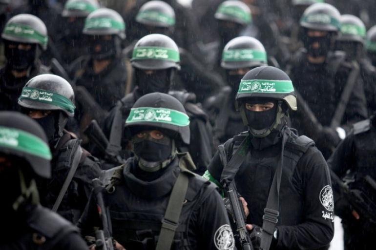 GAZA CITY, GAZA - DECEMBER 14: Palestinian Hamas movement organized on Sunday an elaborate military parade in Gaza City to commemorate the passage of 27 years since its foundation. Hundreds of masked fighters from the group's military wing, the Ezzedin Al-Qassam Brigades, marched through the city's main roads holding locally-manufactured and other rifles as well as mortar shells.