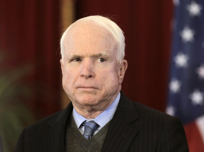 U.S. Senator John McCain listens during a news conference in Riga in this April 15, 2014 file photo. To match Special Report RUSSIA-CAPITALISM/ROCKETS REUTERS/Ints Kalnins/Files (LATVIA - Tags: POLITICS)