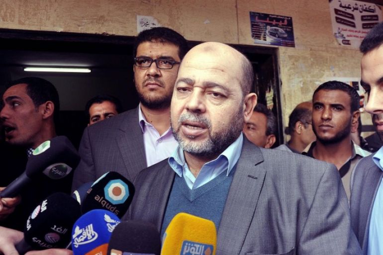 GAZA CITY, GAZA - DECEMBER 06: Palestinian senior member of Hamas, Mousa Abu Marzook (C) speaks to the press after his visiting of the patients at Al-Shifa Hospital in Gaza City, Gaza on December 06, 2014.