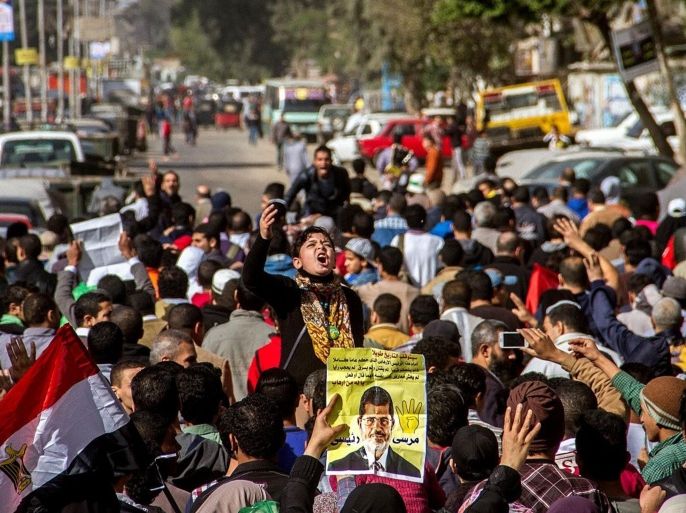 CAIRO, EGYPT - DECEMBER 12: Hundreds of Egyptians called themselves 'Anti-coup' stage demonstrations at al Matariyyah Neighborhood in Cairo, Egypt on December 12, 2014.