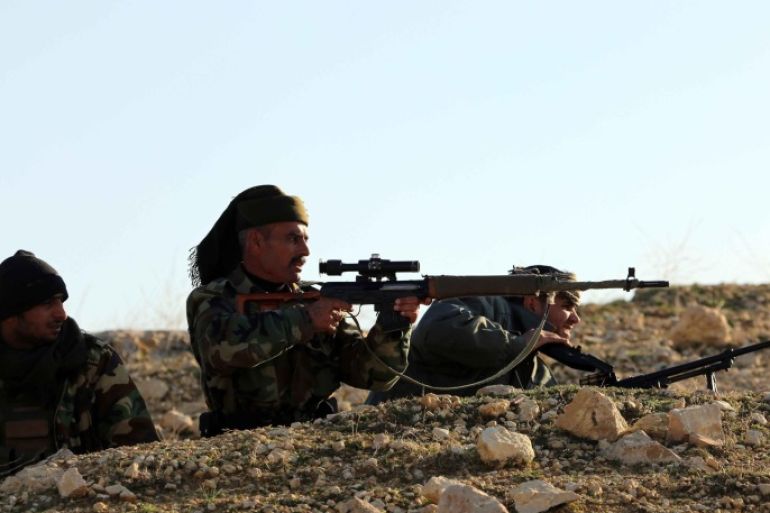 MOSUL, IRAQ - DECEMBER 21: Peshmerga forces take position in fight against Islamic State of Iraq and Levant (ISIL) members in Sinjar district of Mosul, Iraq on December 21, 2014.