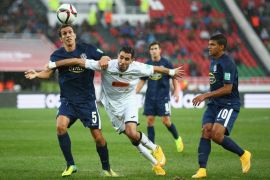 RABAT, MOROCCO - DECEMBER 13: Ahmed Gasmi of ES Setif is tackled by Angel Berlanga of Auckland City FC during the FIFA Club World Cup Quarter Final match between ES Setifienne and Auckland City FC at Prince Moulay Abdellah on December 13, 2014 in Rabat, Morocco.