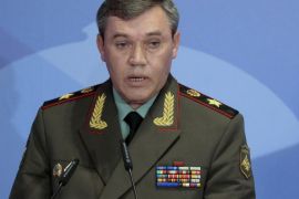 In this Thursday, May 23, 2013 file photo Gen. Valery Gerasimov, the chief of the Russian military's General Staff, speaks during a security conference in Moscow, Russia. The European Union on Tuesday released the names of 15 new targets of sanctions because of their roles in the Ukraine crisis. The list includes Gerasimov and first deputy defense minister, and Lt. Gen. Igor Sergun, identified as head of GRU, the Russian military intelligence agency. (AP Photo/Mikhail Metzel, file)