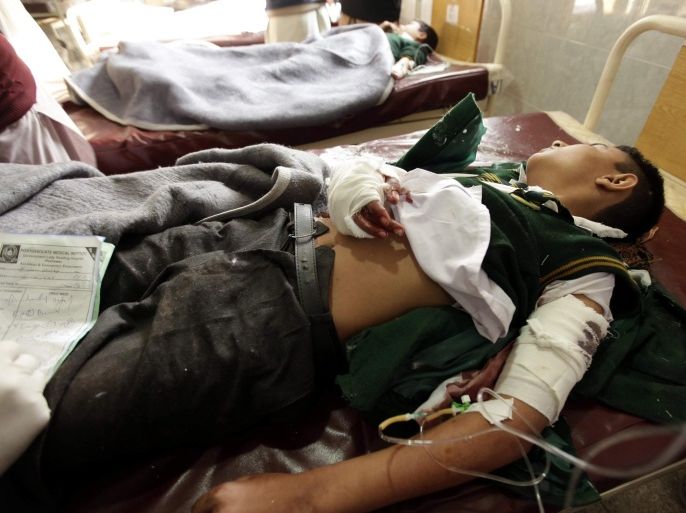 A school boy who was injured in a Taliban attack receives medical treatment at a hospital in Peshawar, Pakistan, 16 December 2014. At least 18 people including teenagers were killed after Taliban militants stormed a military-run school in Peshawar, medics said. 'We have received 18 dead bodies so far,' said Doctor Muhammad Jamil at Lady Reading Hospital in Peshawar city. 'Nine of them are sixteen students and two women.' The death toll may go up as militants have shot many other students in an auditorium at a school, a military statement said.