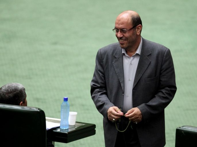 Nominated to be the new Iranian Defense Minister, Hossein Dehghan, a former commander in the powerful Revolutionary Guards, smiles as he attends a session of the parliament to debate President Hasan Rouhani's proposed Cabinet, in Tehran, Iran, Monday, Aug. 12, 2013. Hard-line Iranian lawmakers have challenged the new president's proposed Cabinet makeup, accusing him of nominating pro-Western figures and opposition supporters to ministerial posts. But President Hasan Rouhani told parliament on Monday that his government's priority will be to ease tensions with the outside world and improve the sanctions-battered economy.