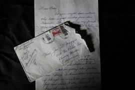 This Friday, Nov. 7, 2014 photo shows part of a three-page handwritten letter and original envelope postmarked Oct. 9, 1954 from baseball legend Joe DiMaggio to Marilyn Monroe on display at Julien's Auctions in Beverly Hills, Calif. DiMaggio's love letter to Marilyn Monroe has sold for $78,125 at a Beverly Hills auction. Julien's Auctions in Beverly Hills says the letter, written by the baseball great after Monroe announced she was divorcing him, was sold Saturday, Dec. 6, 2014, to an undisclosed buyer. (AP Photo/Jae C. Hong, File)