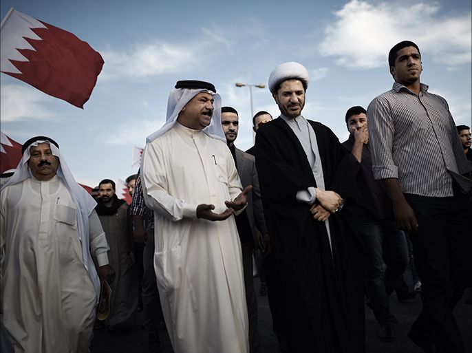 Bahrain's Al-Wefaq opposition group leader Sheikh Ali Salman (C) takes part in an anti-government protest in the village of Jannusan, west of the capital Manama, on December 26, 2014. The Sunni-ruled kingdom held parliamentary elections last November that have been boycotted by the Al-Wefaq movement which calls for democratic reforms. AFP PHOTO / MOHAMMED AL-SHAIKH