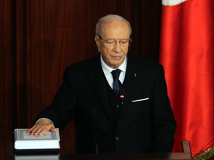 epa04543408 Newly-elected Tunisian President Beji Caid Essebsi takes the oath of office during the swearing-in ceremony at Tunisian Parliament, in Tunis, Tunisia, 31 December 2014. Veteran Tunisian politician Beji Caid Essibsi on 31 December took the oath of office as Tunisia's first democratically elected president, calling for national unity after four years of turbulent transition to democracy. Essibsi, a former prime minister, won 55.68 per cent of the ballots cast in the second round on 21 December, while his rival, outgoing president Moncef Marzouki, received 44.32 per cent. EPA/MOHAMED MESSARA